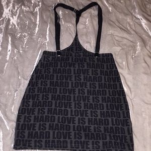 Skirt with suspenders. Fits tight.